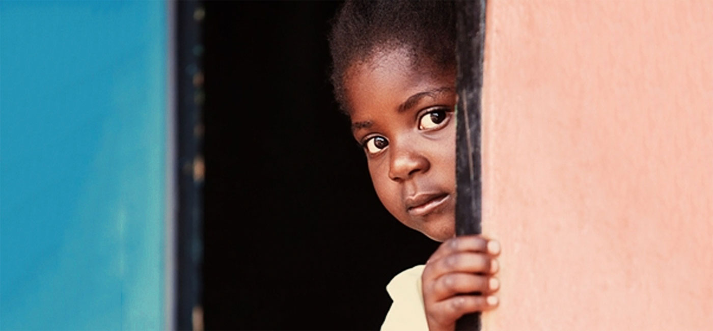 Girl looking around corner