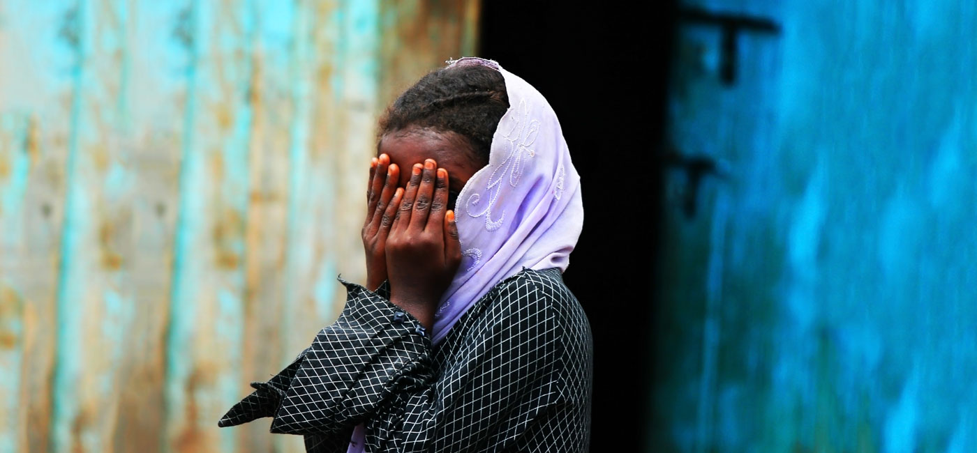 Girl covering face